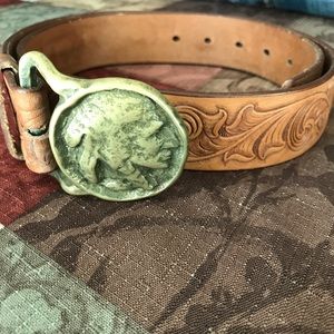 Brass Indian head buckle on tooled leather belt